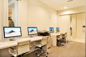 Upscale business center with Apple computers and printer for all of your business needs