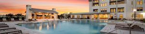 Wide angle shot of the resort-style pool and lounge